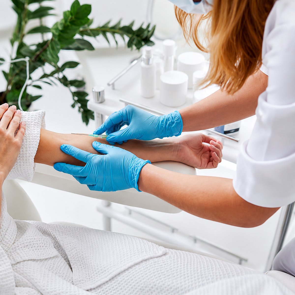 Licensed SlimFit clinician administering an IV treatment